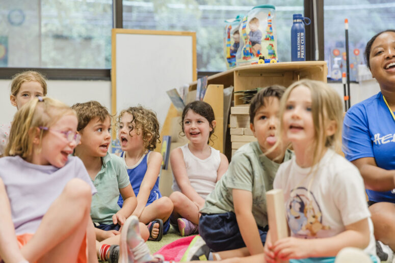 Young children participating in preschool day camp activities