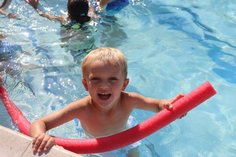 Campers practicing swimming skills at a DC day camp